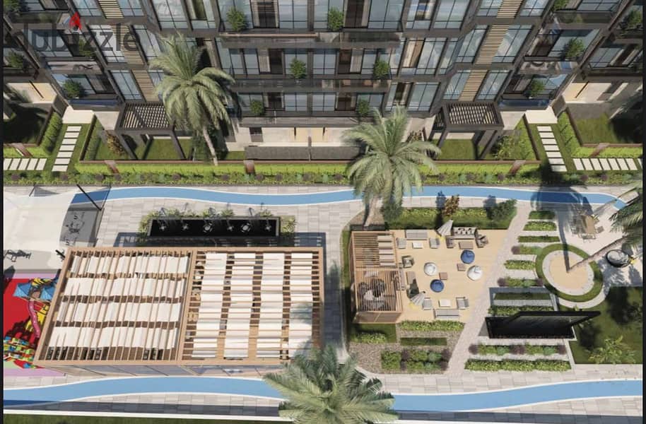 Live in a luxurious apartment with a garden, fully finished, in installments over 9 years, in the heart of old Sheikh Zayed, in UONE 18