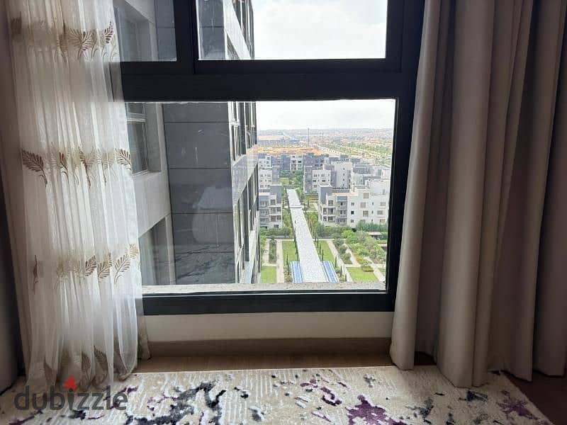 Furnished apartment for sale in Aeon Towers, next to Mall of Arabia, ultra-luxe finishing 7