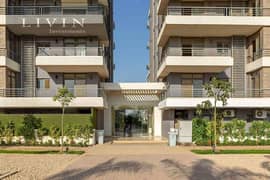 With a down payment of 480,000, a two-bedroom apartment with a garden for sale, open view on the landscape, in front of Cairo Airport in Taj City 0