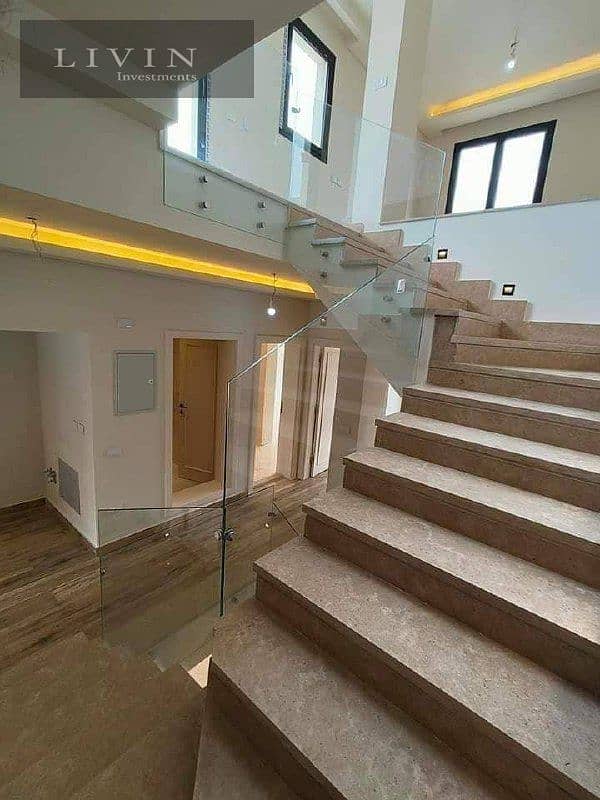 Villa for sale, 3 floors, 5 rooms + 6 bathrooms, at the old price, in installments, in Sarai New Cairo Compound, wall by wall, with Madinaty 2