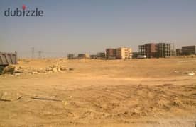 Land for sale in Beit Al Watan in the Fifth Settlement in the Second District, corner of a garden corridor, area of ​​​​3 apartments on the floor