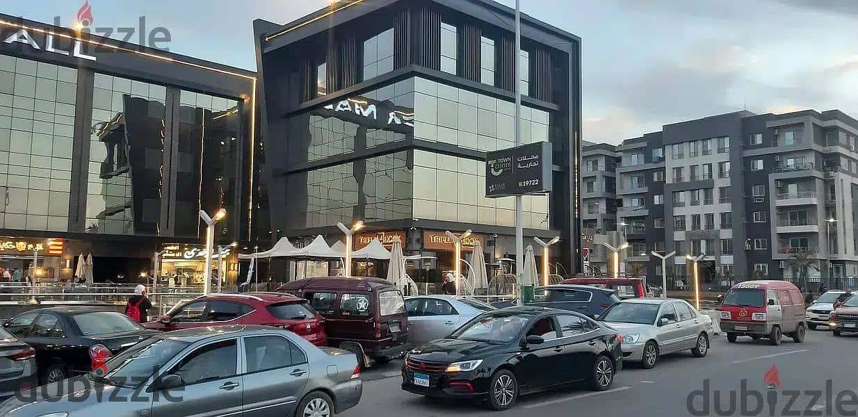 The last shop, first floor, finished, directly on the facade, in the strongest mall in Shorouk, Town Center Mall, with the highest traffic, in front o 18