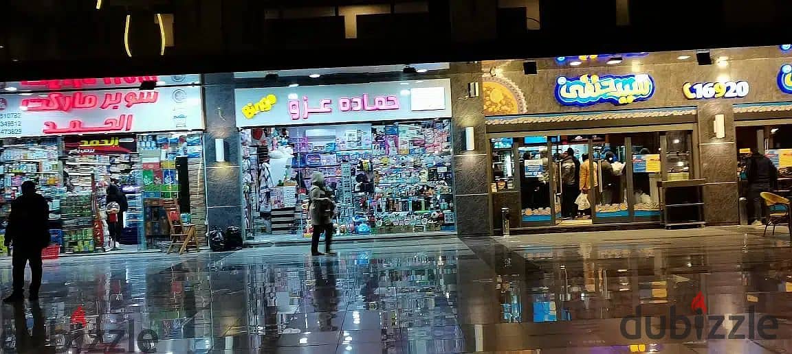 The last shop, first floor, finished, directly on the facade, in the strongest mall in Shorouk, Town Center Mall, with the highest traffic, in front o 19