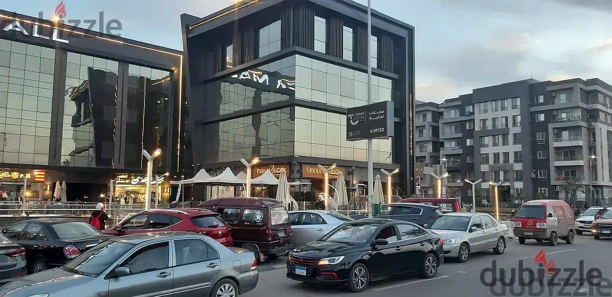 The last shop, first floor, finished, directly on the facade, in the strongest mall in Shorouk, Town Center Mall, with the highest traffic, in front o 18