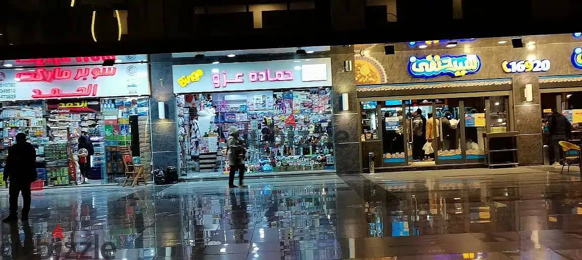 The last shop, first floor, finished, directly on the facade, in the strongest mall in Shorouk, Town Center Mall, with the highest traffic, in front o 19