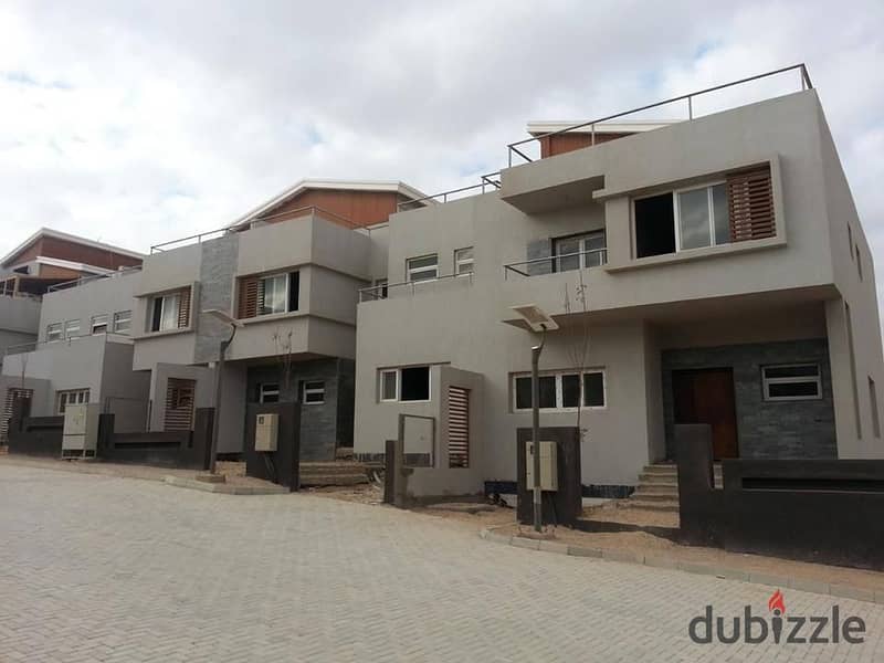 Townhouse at the lowest price in the market, Lagoon view, in Dunes, Sheikh Zayed, in installments 1