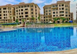 Fully Finished Garden Apartment for sale with Acs and Kitchen Cabinets direct beside AUC and Point 90 Mall with Swimming Pool View New Cairo For Sale