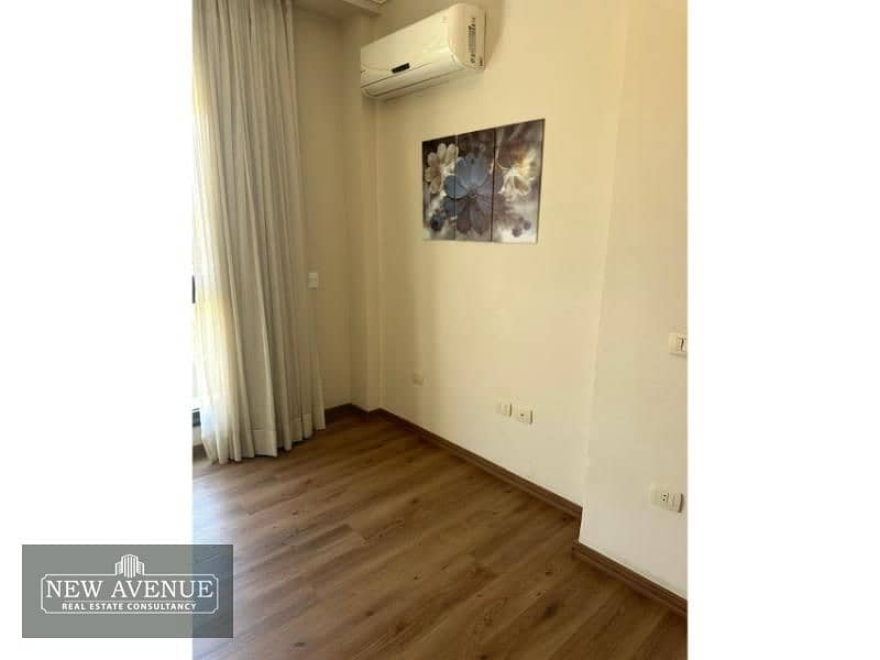 Ready to move Apt for sale in Patio 7 New Cairo - Fully finished with ACS, Semi-furnished with kitchen appliances. 12