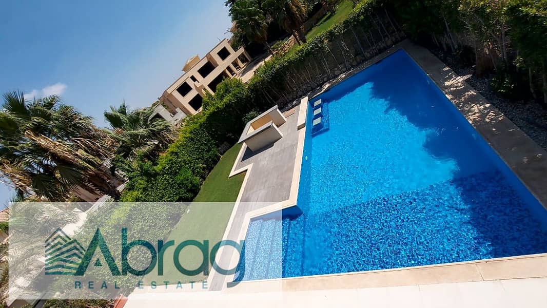 Corner villa for rent, with air conditioners and kitchen, with a swimming pool, in El Guezira Compound, Sheikh Zayed 4