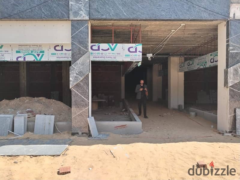 A 50-square-meter shop for immediate delivery, directly facing Town Center Mall, the most densely populated mall in El Shorouk 49