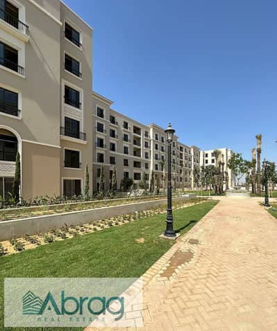 Ground floor apartment with garden for sale in Village West Compound - Sheikh Zayed