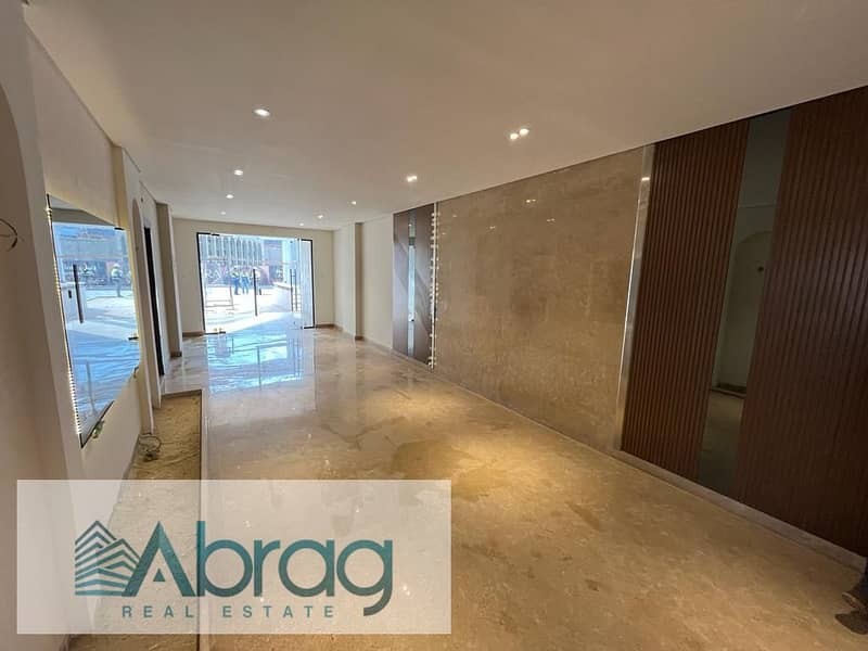 Ground floor apartment with garden for sale in Village West Compound - Sheikh Zayed 7