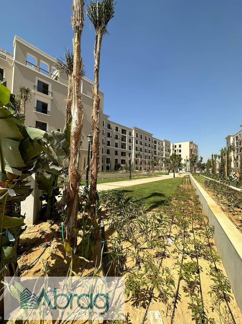 Ground floor apartment with garden for sale in Village West Compound - Sheikh Zayed 8