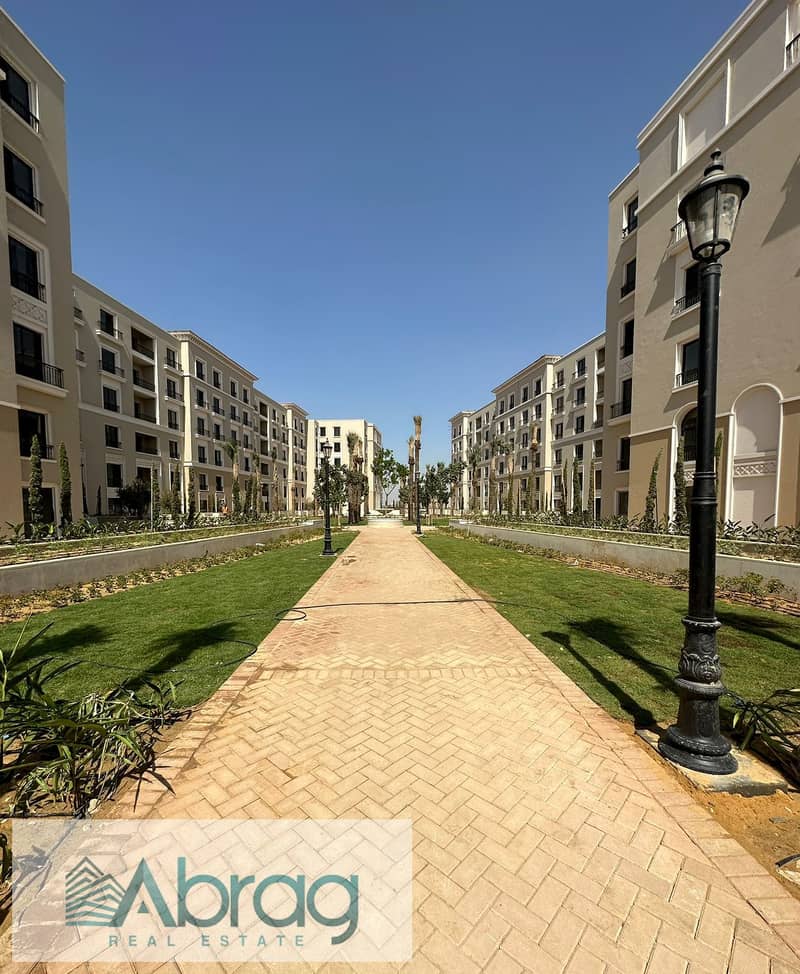 Ground floor apartment with garden for sale in Village West Compound - Sheikh Zayed 9