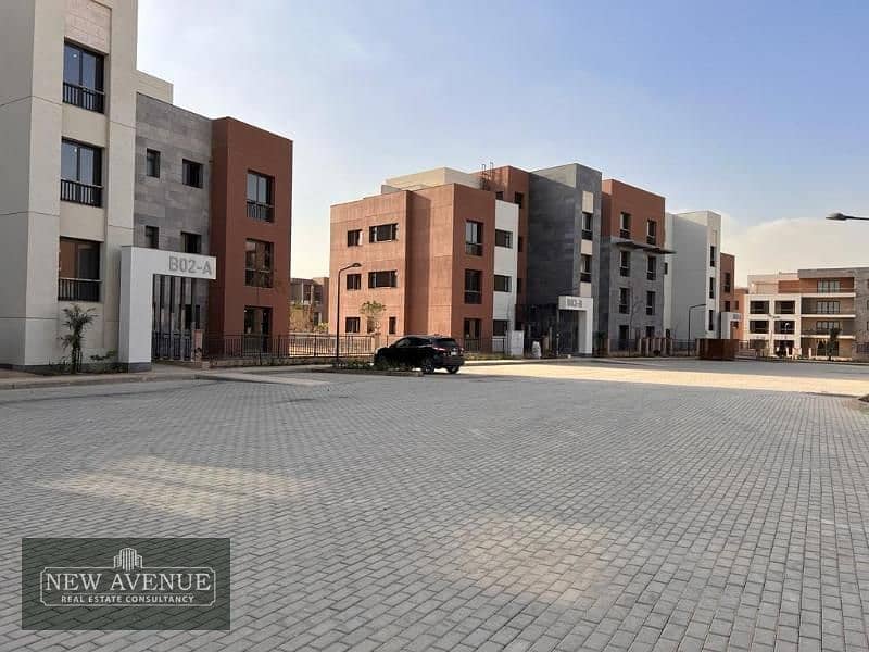 Delivered Apartment Terrace overlooking the landscape and club in District 5 Marakez New Cairo 3