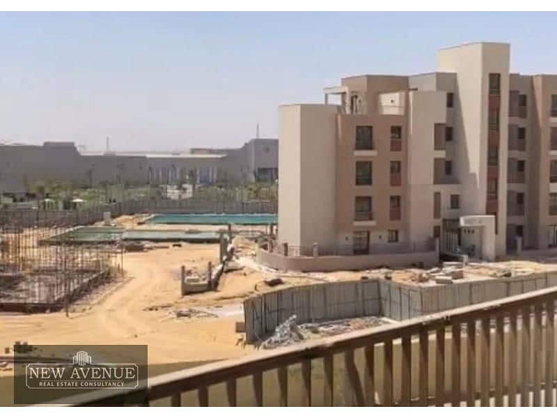 Delivered Apartment Terrace overlooking the landscape and club in District 5 Marakez New Cairo 7