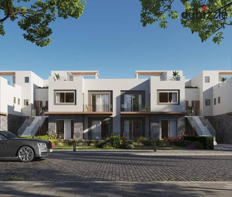 Live in a 3-storey villa in installments over 8 years, prime location in Sheikh Zayed from DUNES 2