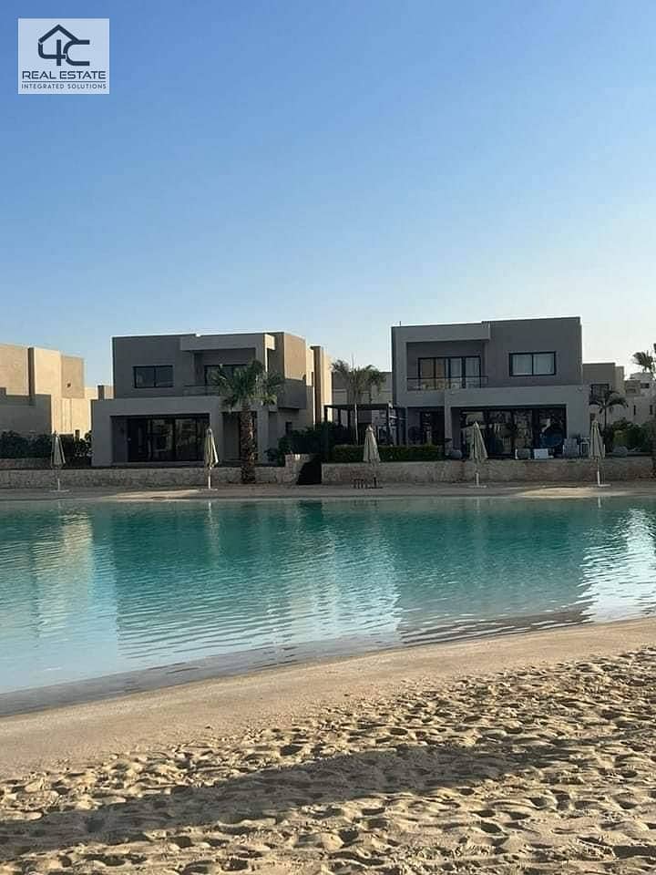 WITH the lowest price in Azha, own a finished duplex with AC and a kitchen,  double view on the largest Crystal Lagoon and directly to the sea 20