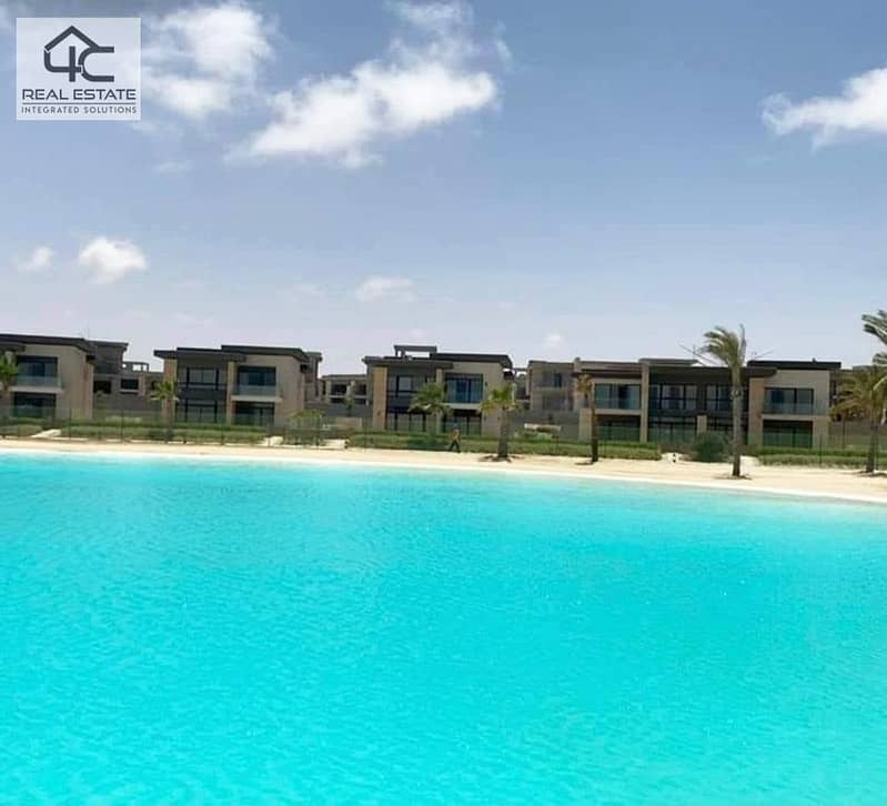 WITH the lowest price in Azha, own a finished duplex with AC and a kitchen,  double view on the largest Crystal Lagoon and directly to the sea 24