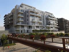 apartment Corner Fully Bahary 165 m for sale Lagoon Beach Park Mountain Veiw iCity New Cairo