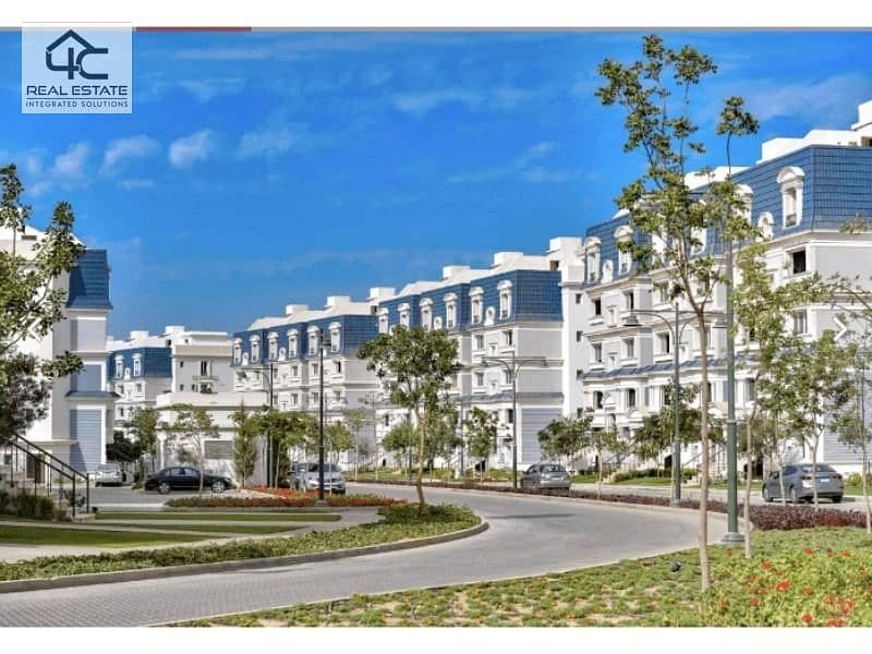 In installments, a corner apartment in the best location, Direct on the Lagoon, in Mountain View iCity Compound 1