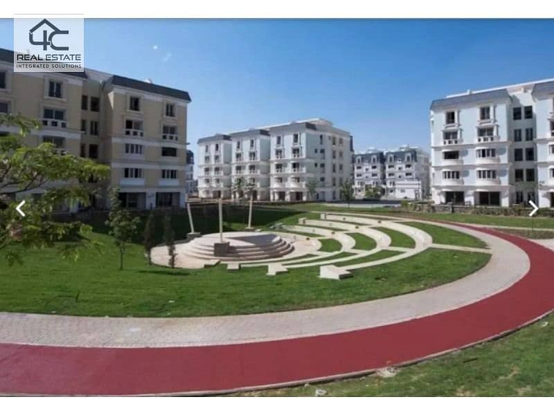 In installments, a corner apartment in the best location, Direct on the Lagoon, in Mountain View iCity Compound 2