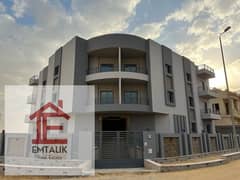 Apartment for sale, first floor, semi-finished, in the West Golf Extension Compound, the second number from Gamal Abdel Nasser Axis and next to Katame