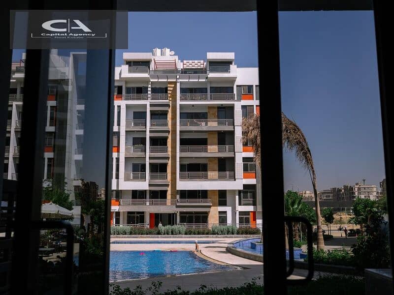 Apartment with Roof for sale in Fifth Settlement, Golden Square, in icon Compound, with only 15% down payment 30% cash DIS | view of the landscape 21