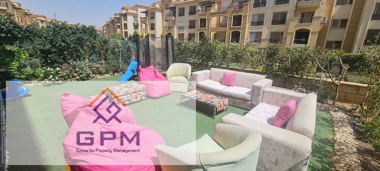 Apartment with private garden for sale in Stone Residence Compound - New Cairo 1