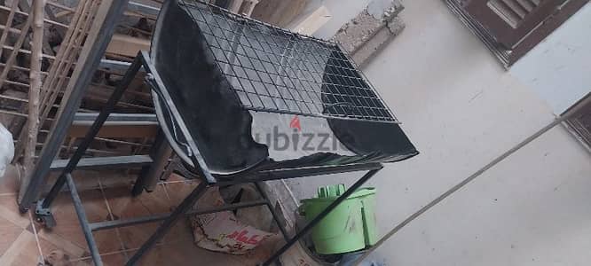 Portable charcoal grill  (black color).