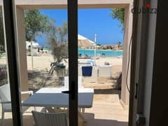 A roofed chalet with a direct view of the Lagoon for sale in John Sodic, Ras el hekma