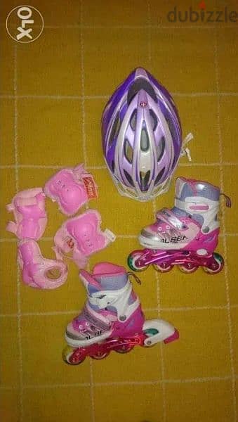 barely used Rollerblade + knee shields + helmet adjustable to 4 sizes