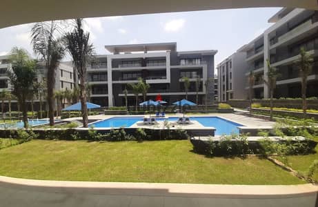 Apartment Ready To Move with garden in El Patio Oro Lavista in Fifth Settlement In golden square A very distinctive view of the landscape and water