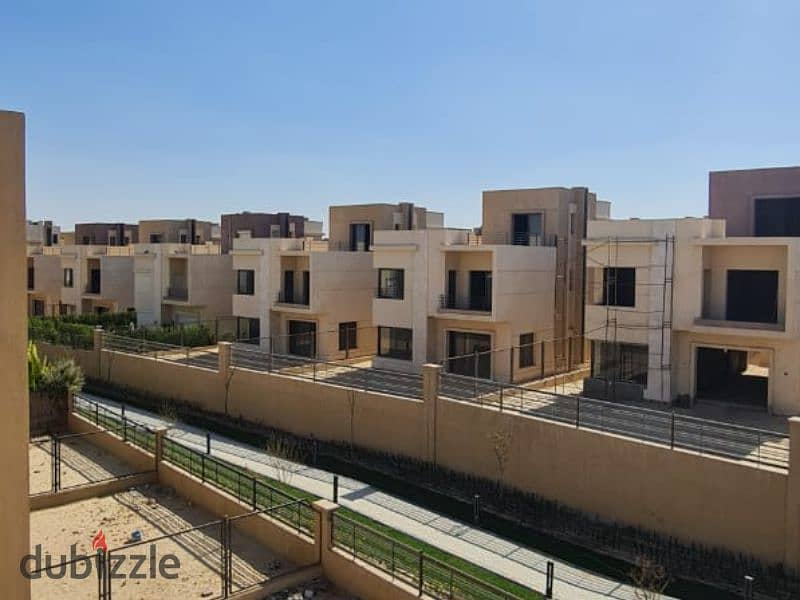 Villa for rent in Alma Compound, Sheikh Zayed, next to Arkan Plaza First residence, with kitchen, air conditioners, and fully equipped garden. 11