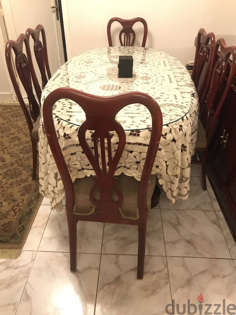 A classic dining buffet , table with it's chairs 2