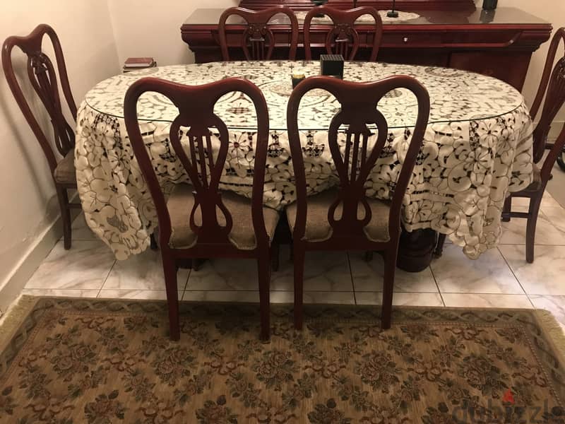 A classic dining buffet , table with it's chairs 3