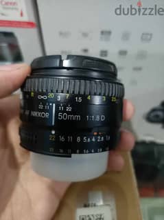 لينس نيكون Nikon 50mm f/1.8D بحالة الزيرو بالكرتونة وكافة مشتملاته