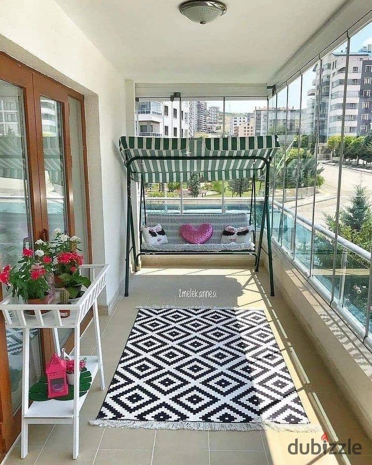 Apartment for sale in a private garden, in installments, on a very special view, on the Landscape, in front of Cairo Airport, in the Taj City Compound 1