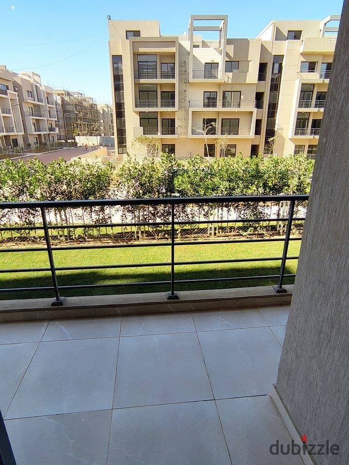 A luxury 115m apartment for sale + Garden in installments in front of Cairo Airport in Taj City 12