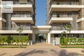 Prime location apartment, distinguished division, for sale in a compound with integrated services, directly on the Suez Road, Taj City Compound