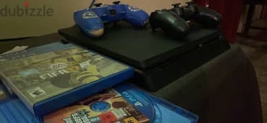 PlayStation 4 slim 1 Tb with 2 controllers and 5 games