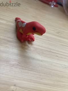 A hand made polymer clay dinosaur toy 0