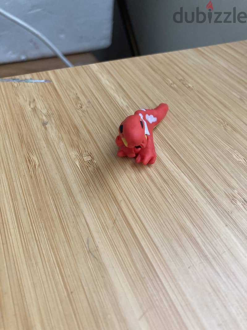 A hand made polymer clay dinosaur toy 3