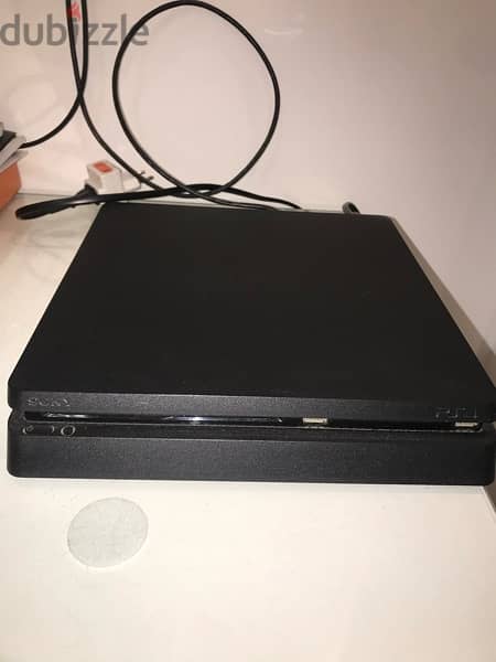 ps4 slim 1 tb + 2 original controllers + 4 games 0