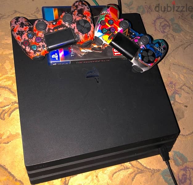 ps4 pro حاله ممتازه اعلى سوفت  دراعين واحد اورجنال واحد كوبي عليه العا 1