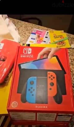 Nintendo switch Oled nearly new with box, games and accessories. 0