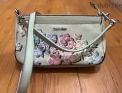 Calvin Klein's flowery green cross bag