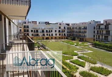 For sale, a ground floor apartment with a garden in the Courtyard - SODIC West - Sheikh Zayed inside Beverly Hills 0