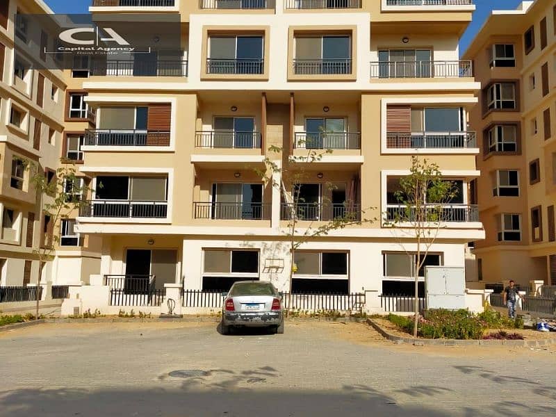 Ground floor apartment with garden, 106 meters in Taj City, with a 5% down payment and a cash discount of up to 39% in the Fifth Settlement 1