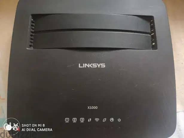 روتر Linksys x1000 بحالة ممتازة و الأدبتور الأصلي 3